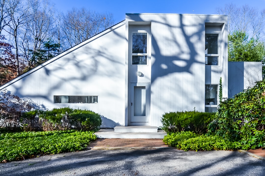 A beautiful modern suburban home with excellent curb appeal, featuring a brand new, perfectly installed dark shingle roof that adds significant value to the property.