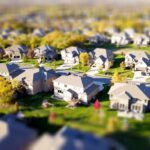 Homeowner or contractor carefully reviewing architectural blueprints in a bright, modern setting, symbolizing the planning...